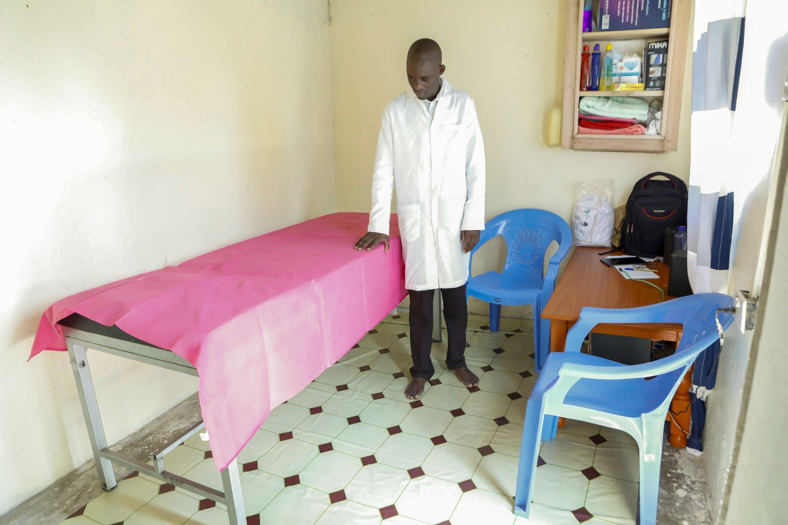 A man standing in a therapy room.