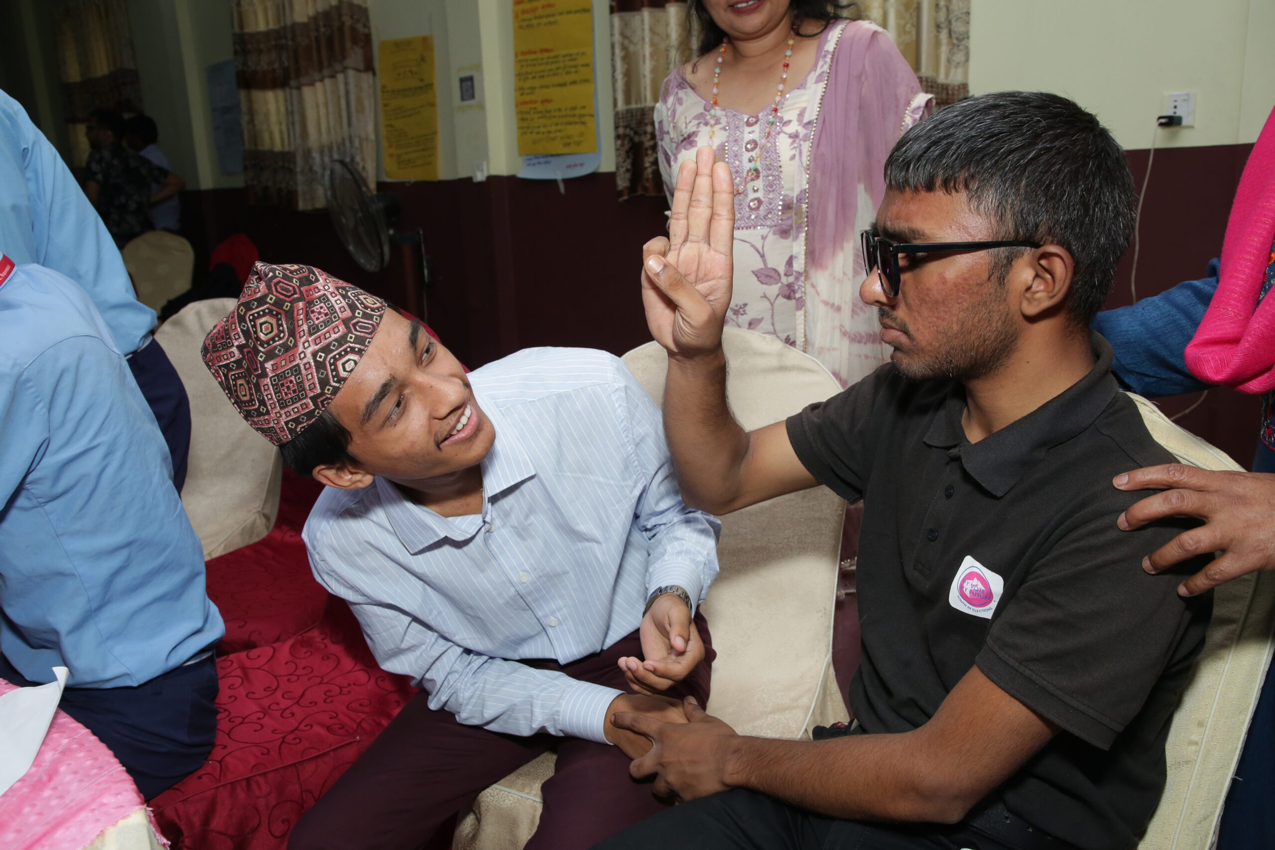 A young man communicating in sign language.