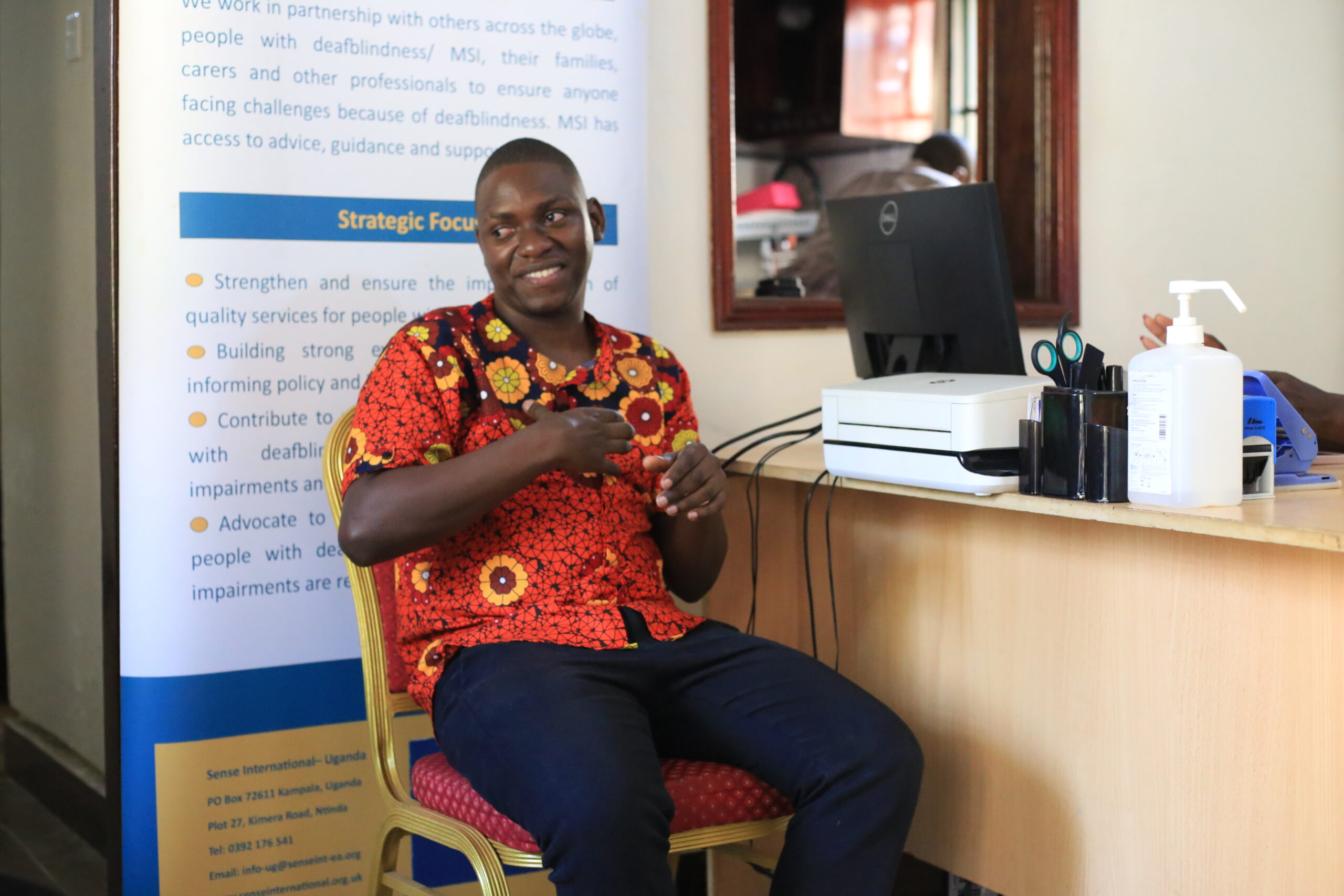 A man sitting on a chair in an office